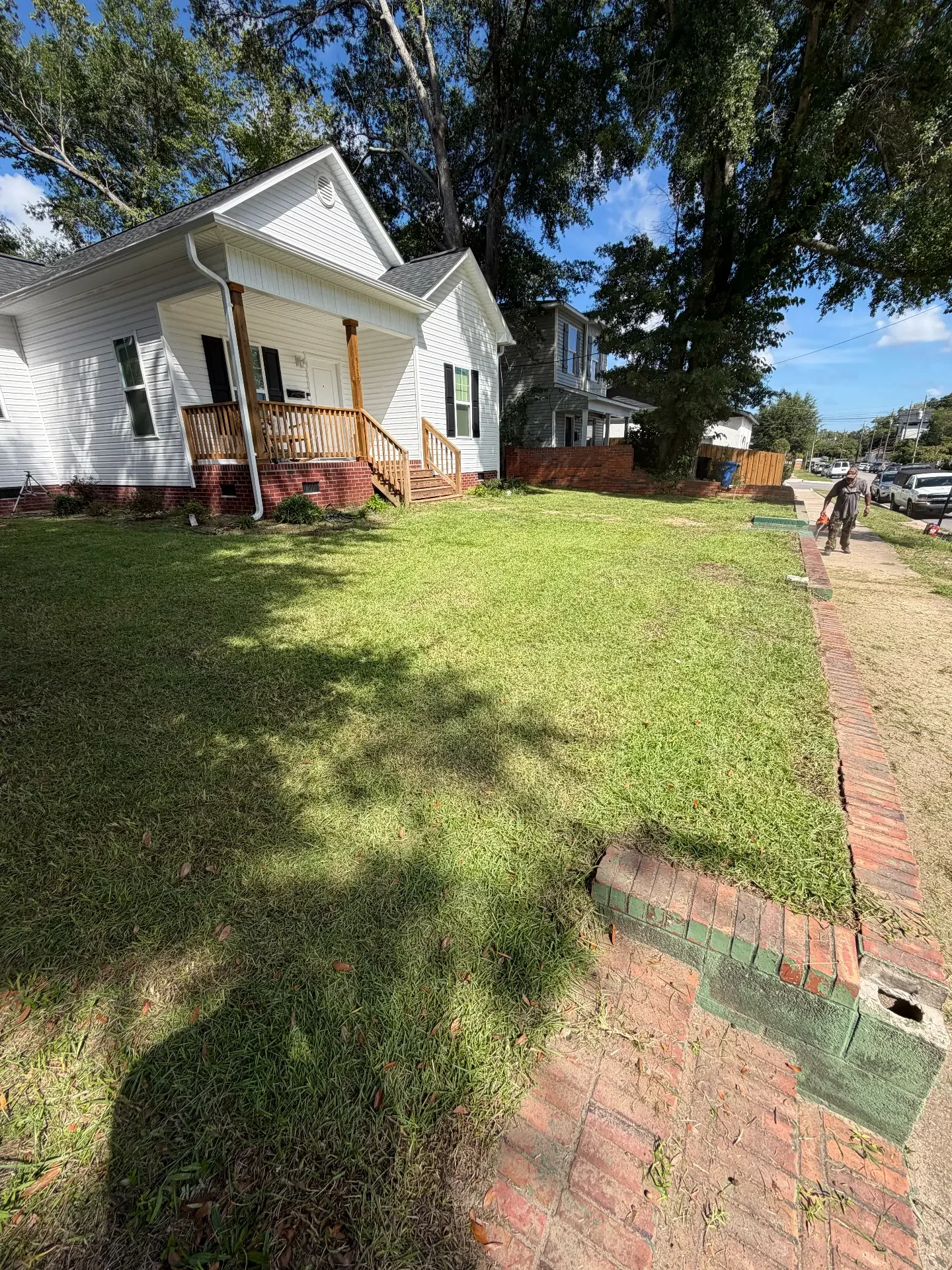 Landscaped backyard with stone edging and mulched beds